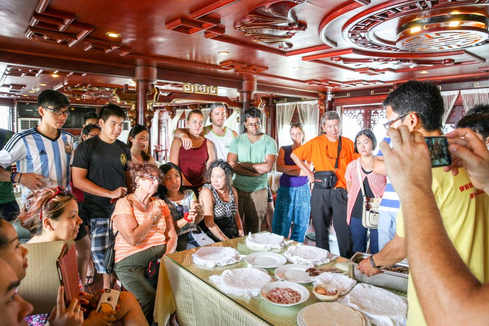 2-Day Royal Palace Ha Long Bay & Ti Top Island Cruise - Day 1 after sunset: upper-deck party, karaoke, and squid fishing