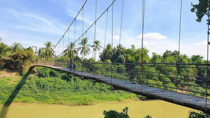 Battambang: Tuk-Tuk, Bamboo Train, Killing/Bat Caves, Sunset - Countryside Stops: Villages, Fruit Plantations, Rice Fields, and a Suspension Bridge