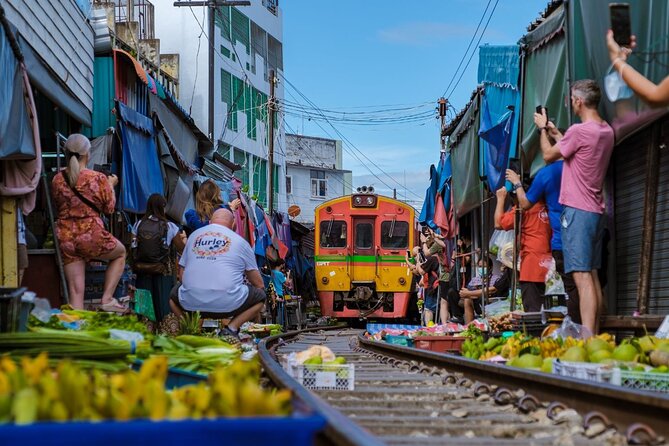 Damnoen Saduak Floating Market and Maeklong Railway Market Tour - Wat Bang Kung banyan-root chapel: a short cultural stop that can steal the day