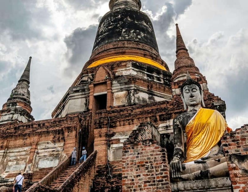 From Bangkok: Ayutthaya Heritage Tour with Sunset Boat Ride - Wat Maha That: the Buddha head in tree roots