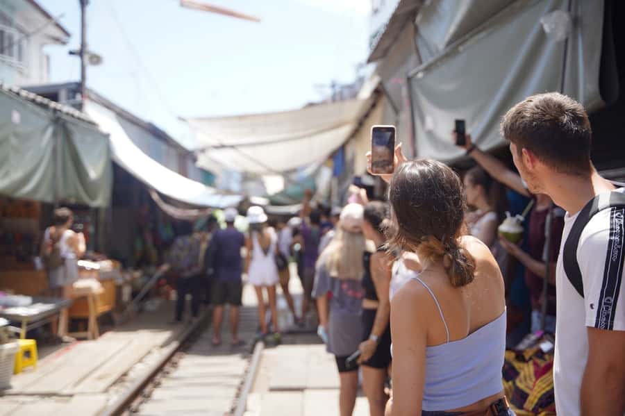 From Bangkok: Floating Market and Ayutthaya Guided Day Tour - Maeklong Railway Market: seeing stalls pull back for the train