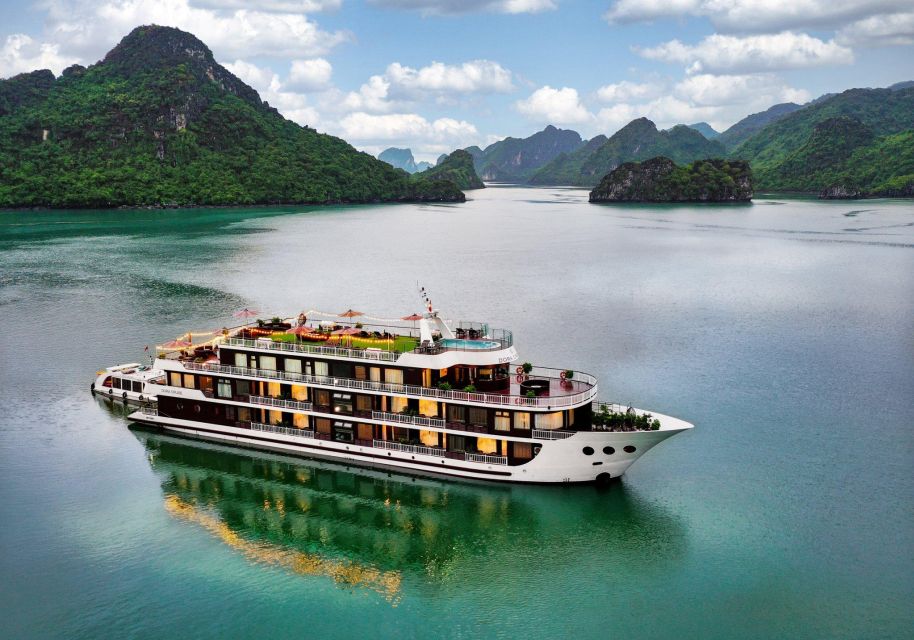 From Hanoi: 2-Day Cruise Trip with Private Balcony & Bathtub - First cruise day: welcome drink, briefing, and your first meals on board