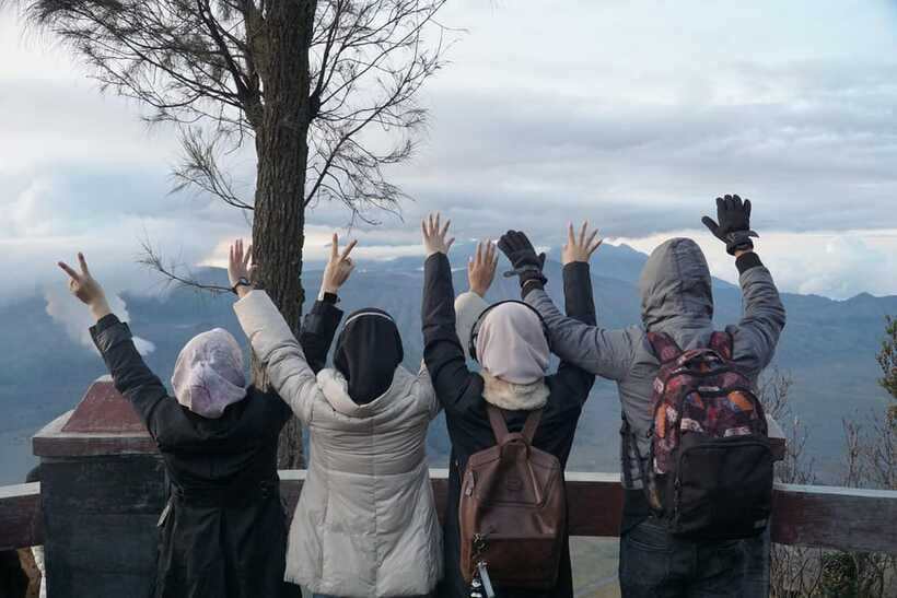 From Malang: 1-Day Mount Bromo Shared Trip - Teletubbies Hill: green contrast against blue-green skies