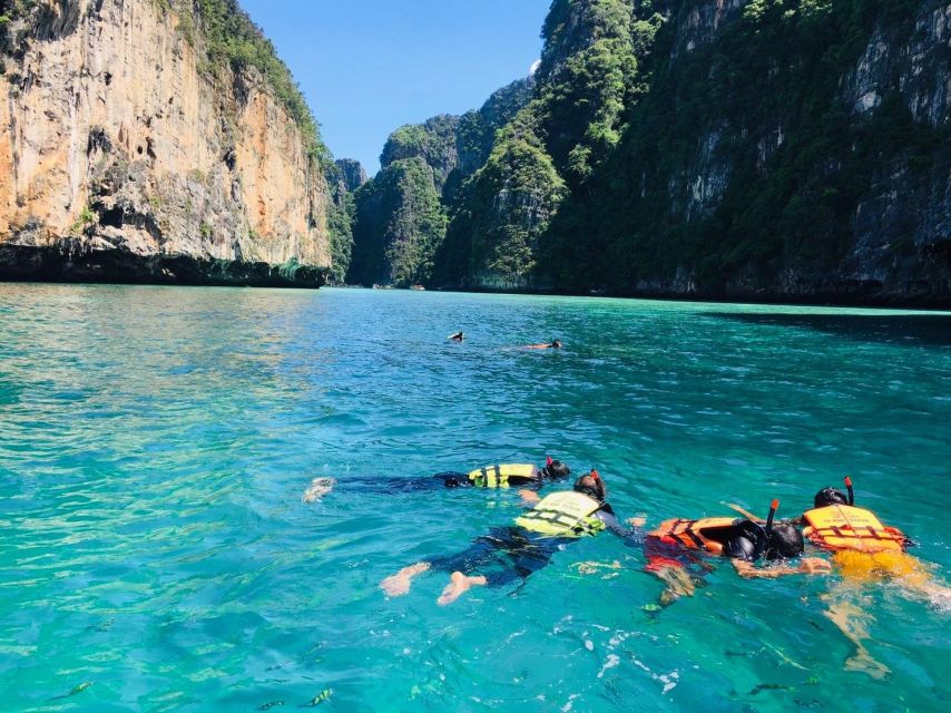 From Phi Phi: Half-Day Longtail Boat Tour with Snorkeling - Maya Bay: stunning coastlines, crowds, and that park fee