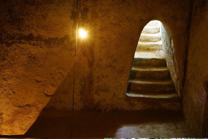 Half-Day Cu Chi Tunnels Guided Exclusive Experience with Pick Up - What happens at Cu Chi: documentary, living areas, traps, and bomb craters