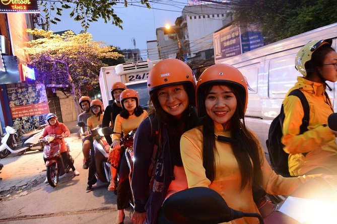 Hanoi Motorbike Tours Led By Women: Hanoi By Night Foodie Motorbike Tours - Past Ho Chi Minh memorial: nightly ceremony moments from the road