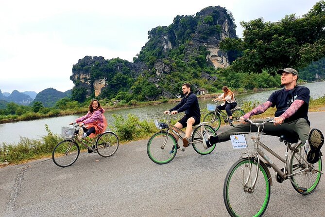 Highlight Ninh Binh Full Day Tour Tam Coc Boat, Mua Cave, Hoa Lu - Tam Coc Bamboo Boat Ride: Caves, Water, and Paddy Views
