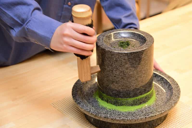 Kyoto: Tea Museum Tickets and Matcha Grinding Experience - Grinding tencha into matcha at the tea mill with an instructor