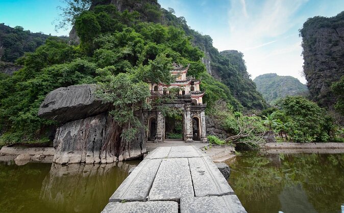 Ninh Binh Day Trip: Bai Dinh-Trang An-Mua Cave, Buffet, Boat, Bus - Trang An UNESCO caves: a bamboo-boat ride that slows your head down