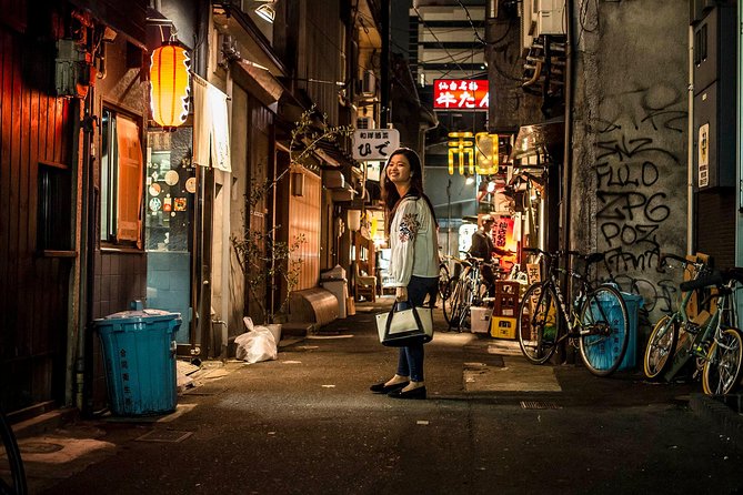 Osaka Backstreet Nightlife & Street Food Walking Tour - Stop 3: Dotonbori canal chaos and the Glico photo run