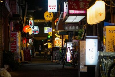 Osaka Bar Hopping Night Walking Tour in Namba (3 bars, 6 tastes) - Getting Oriented: FamilyMart Start, Glico Sign, and Shinsaibashi-Suji