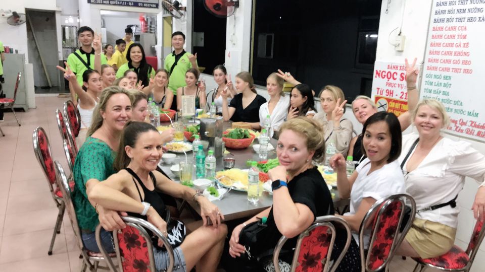Saigon: Day-Night Sights & Local Food Tour l Female Option - Nguyen Trai Street and bridge views: snack pacing with a city reset