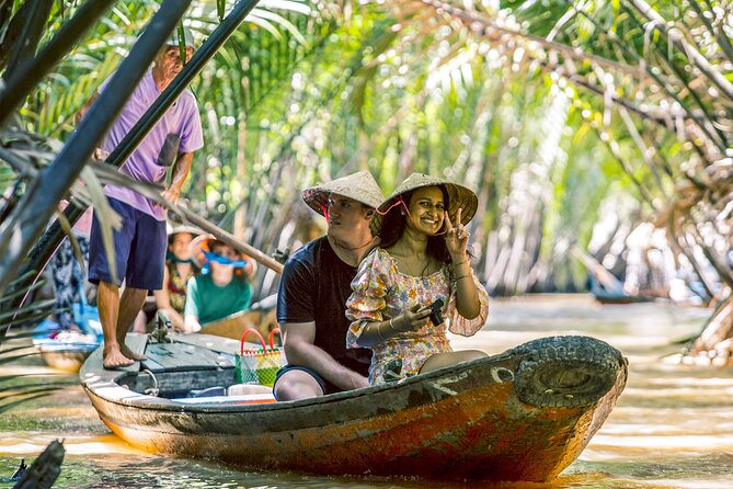 Small-Group Mekong Delta Day Trip: Boat Ride, Cottages & Pagoda - Cruising the Mekong: motorboat views and the hand-rowed feel