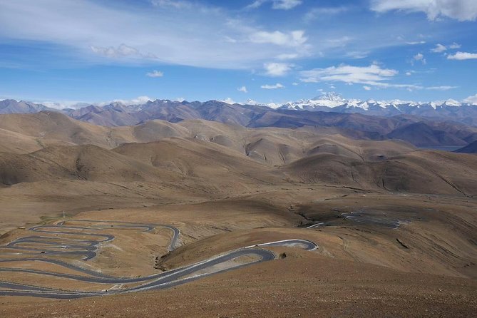 Tibet Tour 8 Days Lhasa to Everest Base Camp Small Group Tour - Yamdrok Yumtso and the Karola La road: passes, glacier views, and prayer flags